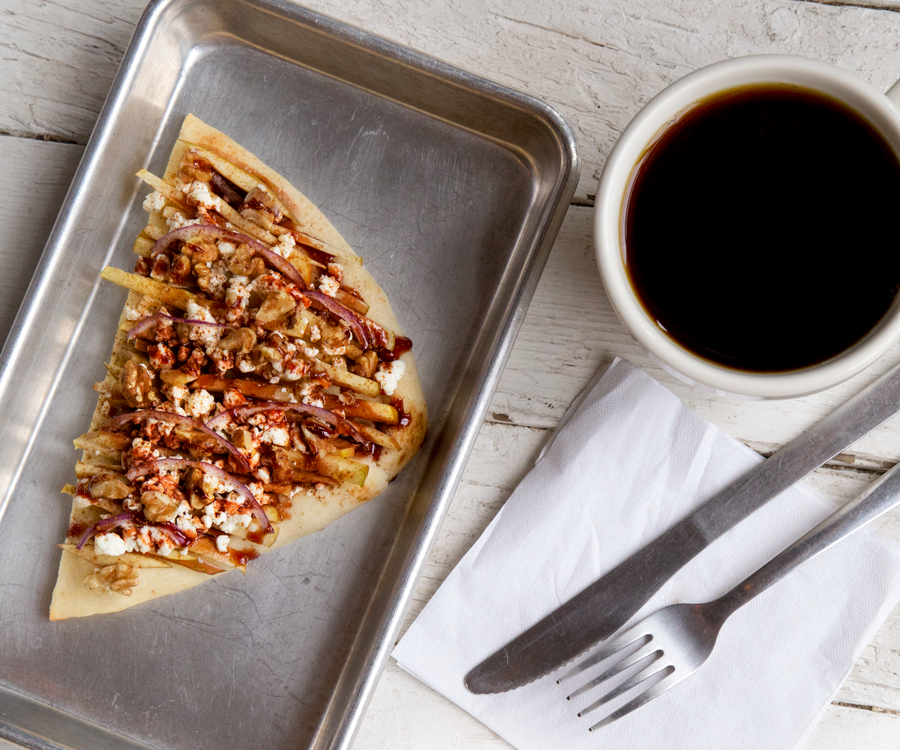 Eurasia Coffee & Tea's goat cheese and apple toast with walnuts and pomegranate syrup.