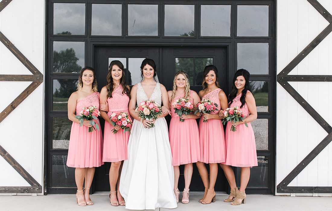 bride and bridesmaids with short pink dresses