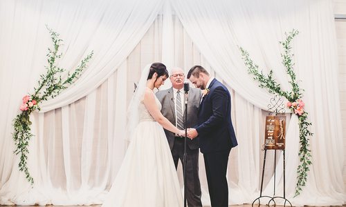 bride and groom during wedding in Joplin, MO