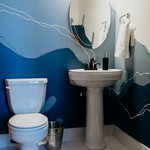 Slider Thumbnail: Sea mural in powder bathroom by Kori Smalley.