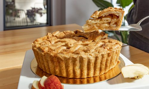 Apple pie with slice taken out