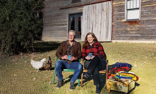 Speed family sitting outdoors.