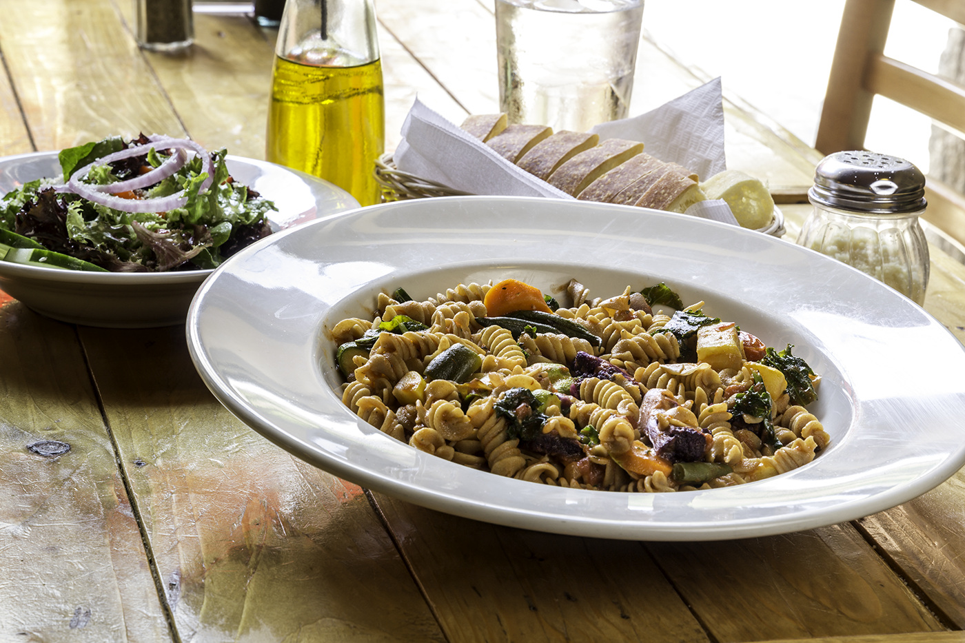 Pasta dish and salad and Bambino's Café in Springfield, MO