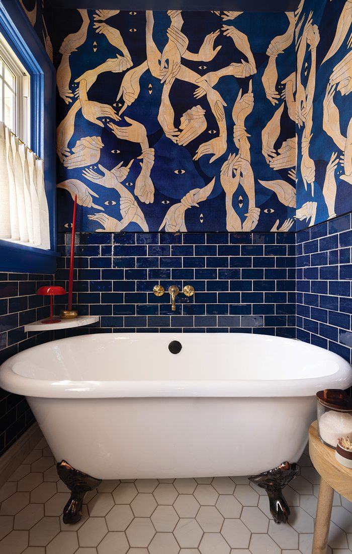 Claw bathtub in renovated bathroom.