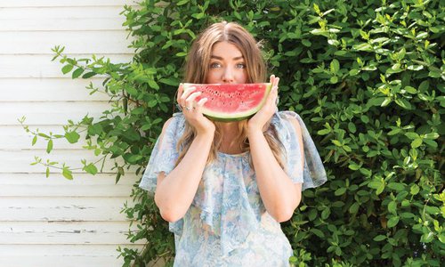 woman with a slice of watermelon