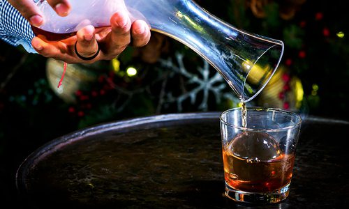 Smoked Old Fashioned at Big Cedar Lodge being poured into a glass