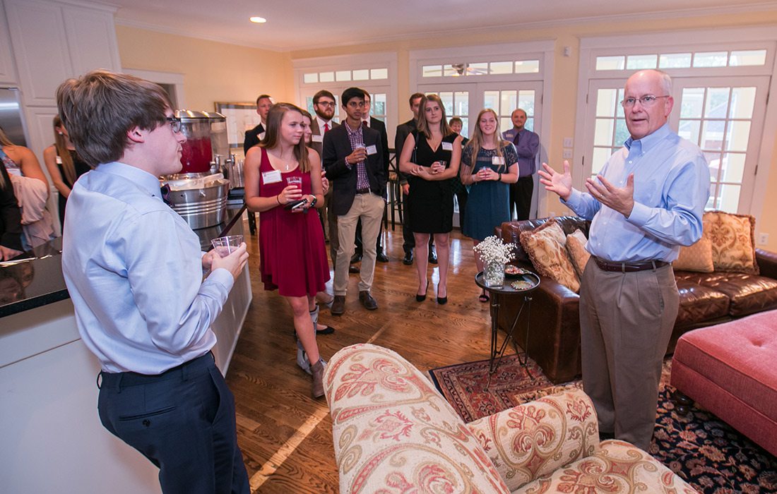 Clif Smart with students at a banquet for Presidential Scholarship recipients