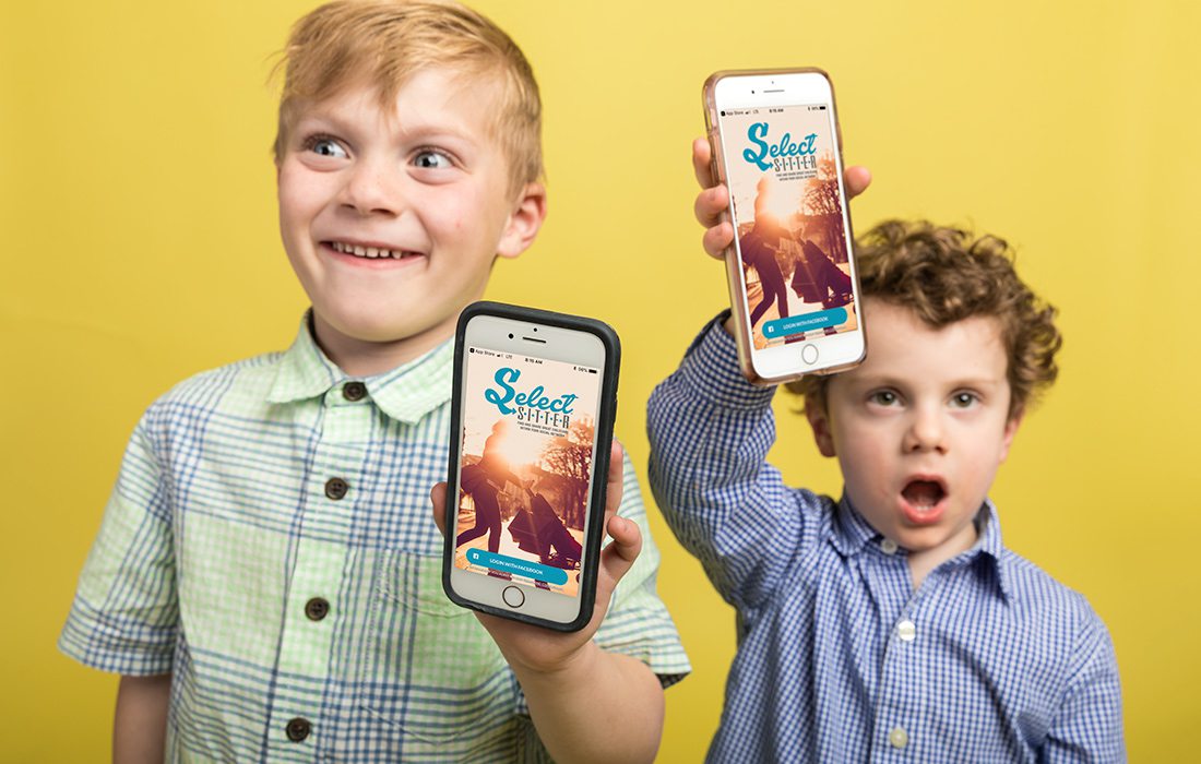 Kari Hamra's son (left) and Adam and Sarah Howey's son (right) holding phones that show off the SelectSitter app.