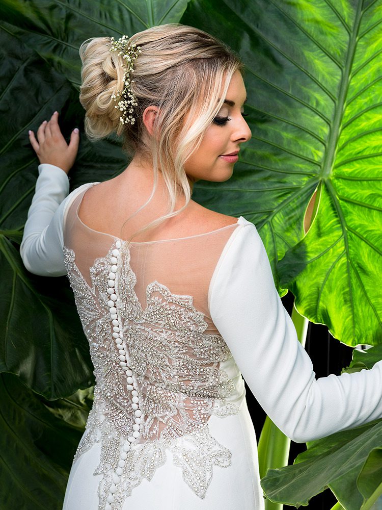 Ivory detailed back beading long sleeved wedding dress at Normans Bridal Springfield MO