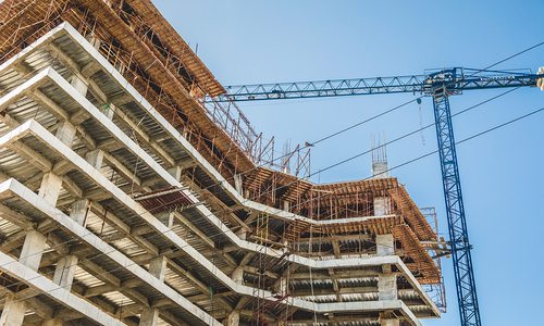Building construction site with a crane