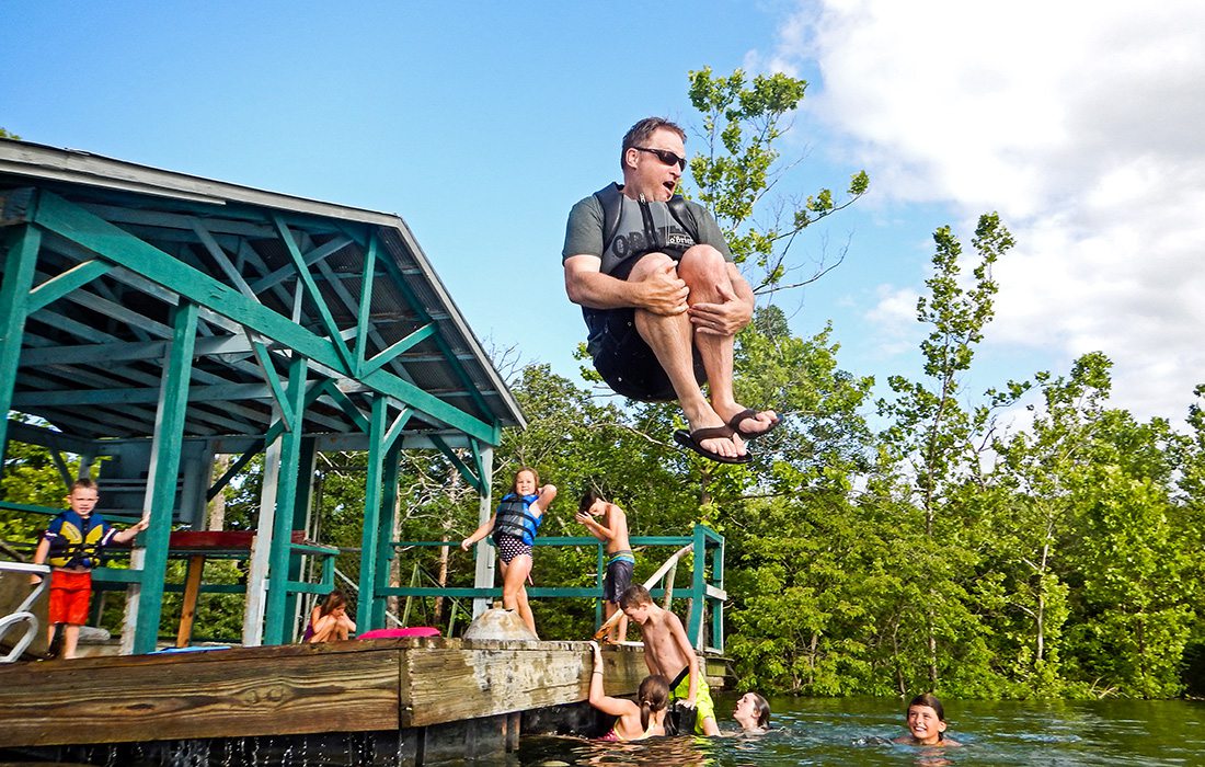 Dad doing a cannon ball into Table Rock Lake