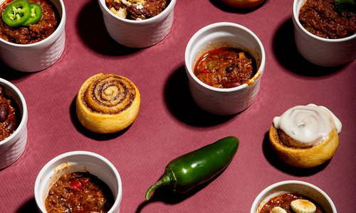 Bowls of chili and cinnamon rolls