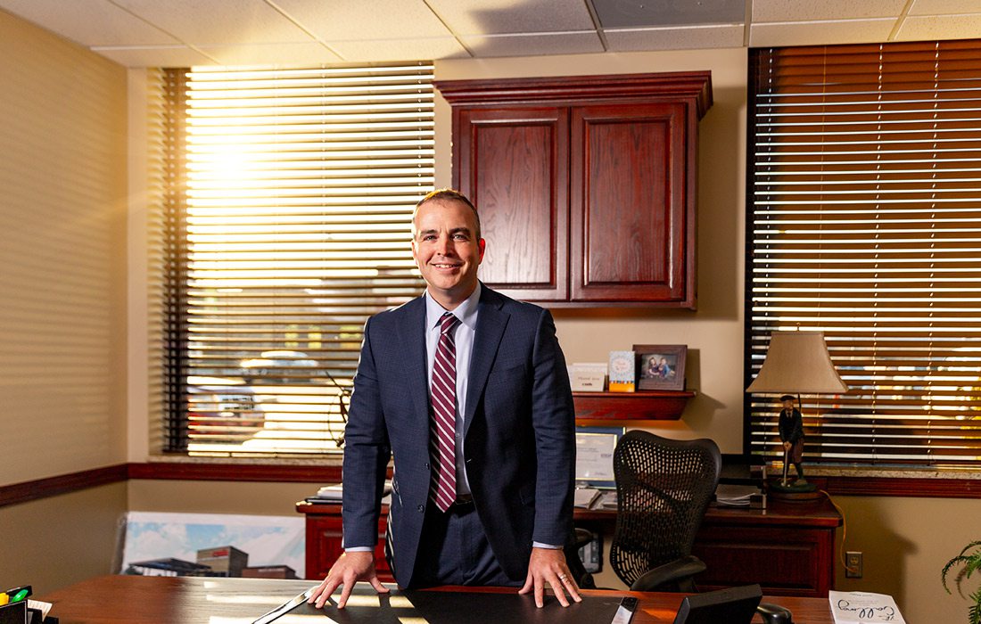 Michael Calhoun at desk