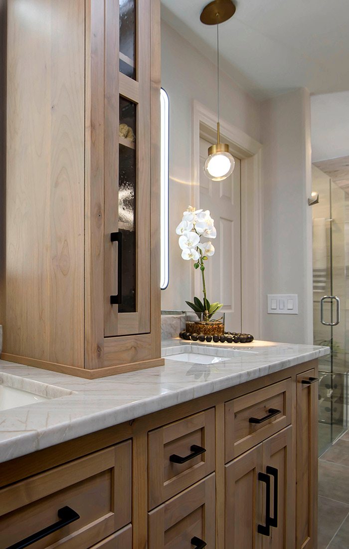 Cabinets and lights in renovated bathroom