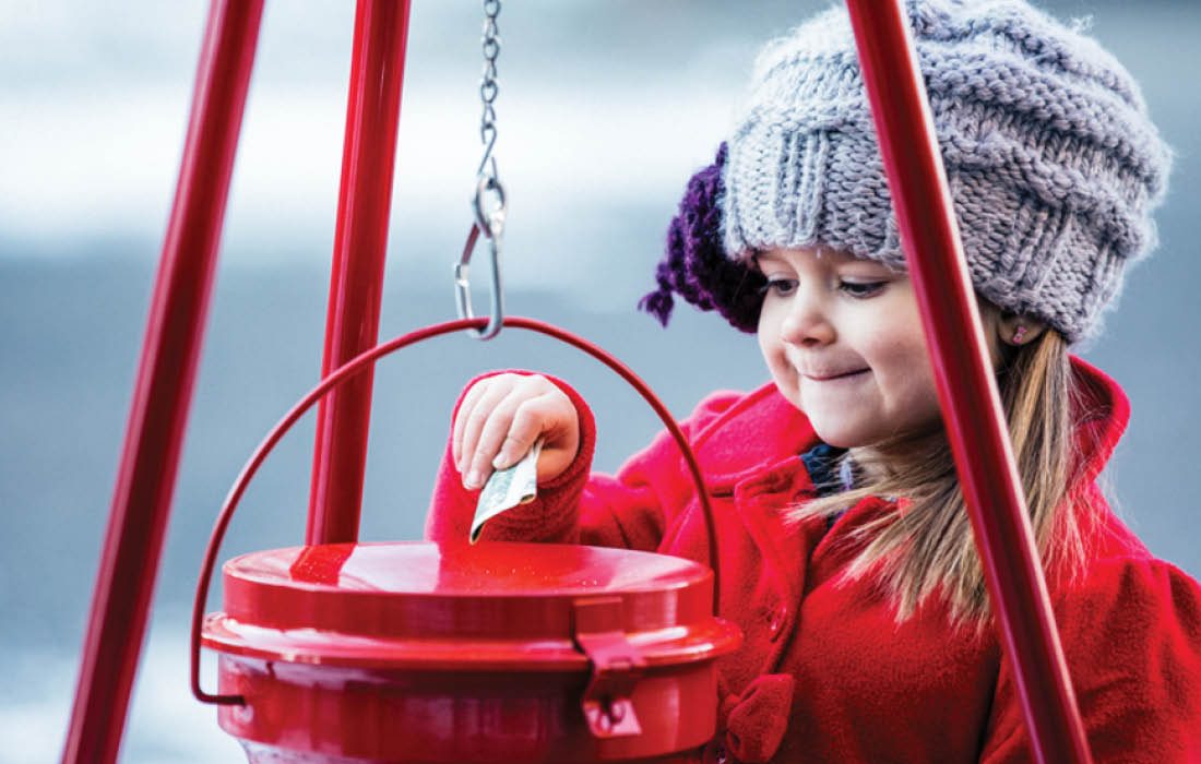 Child donating to Red Cross