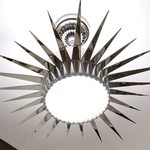 Slider Thumbnail: Silver sunburst chandelier.