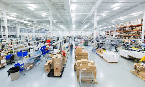 Bright factory floor at Digital Monitoring Products in Springfield MO