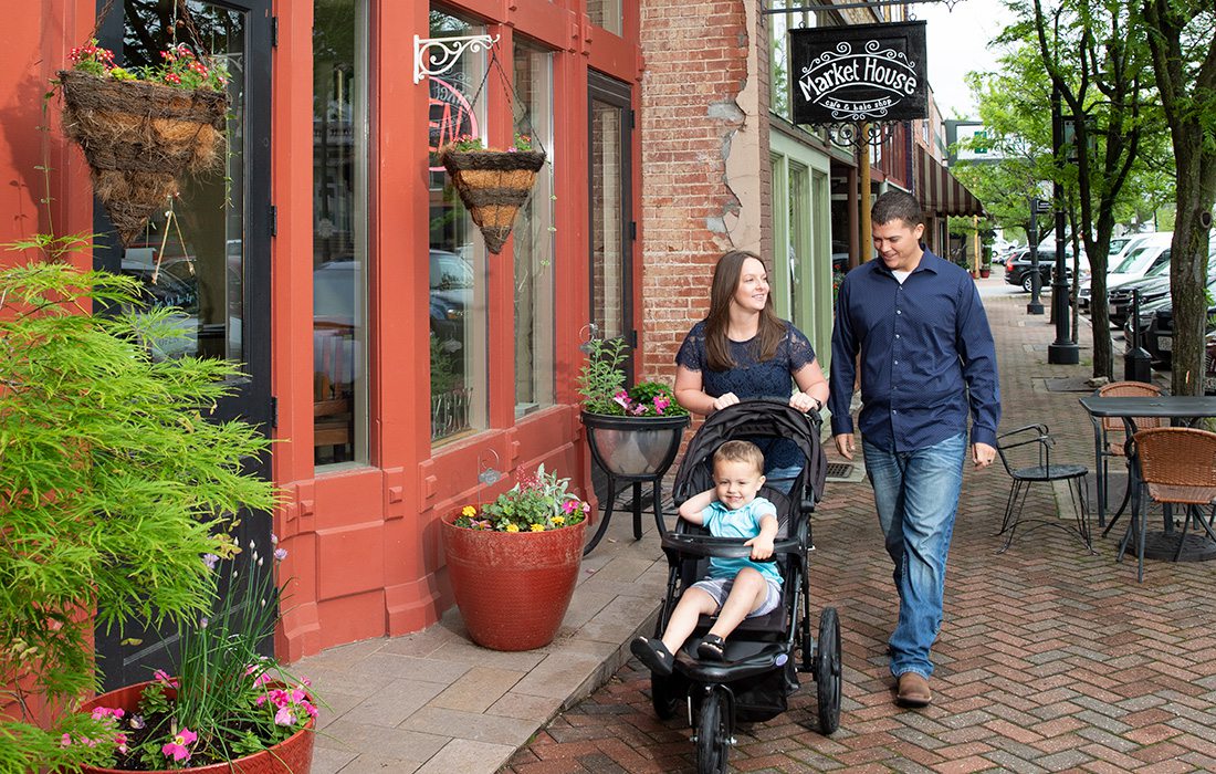 Young family walks in Downtown Ozark, MO