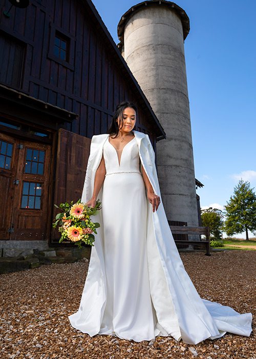 Ivory Diana gown and wedding cape from The Dress in Springfield MO