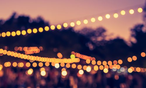 glowing string lights at sunset