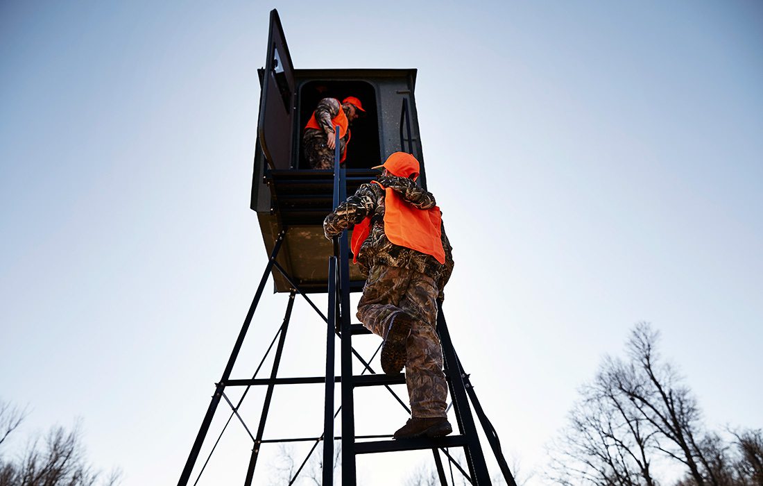 guys getting into a deer stand