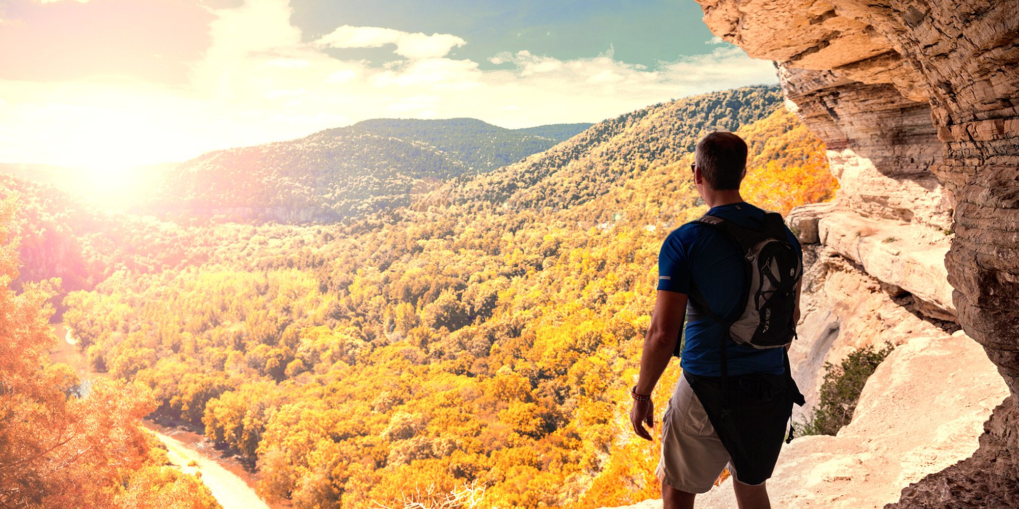 Man looking over the Ozarks from Goat Trail