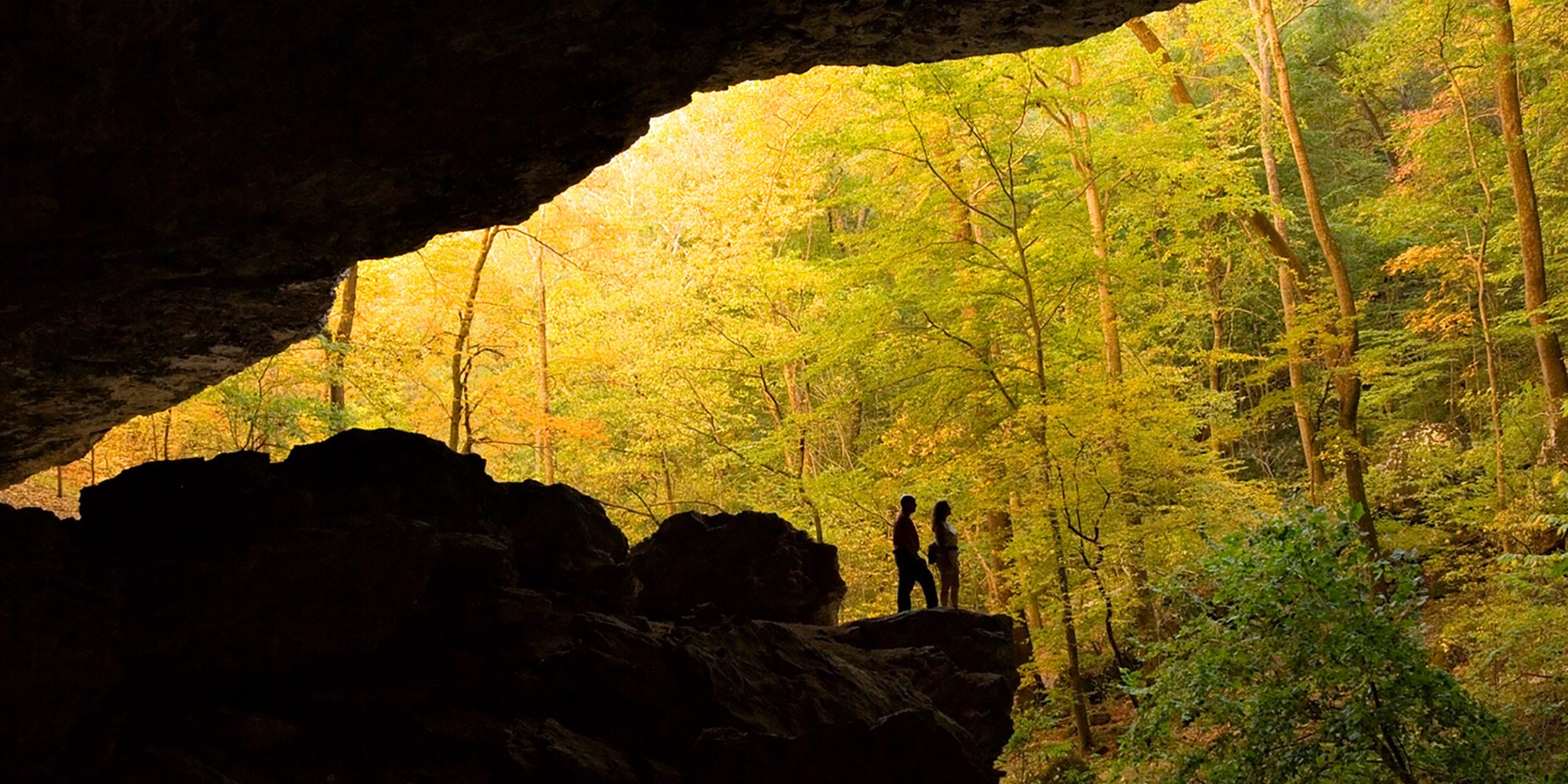 Couple silhouetted in Edens Fall Cave