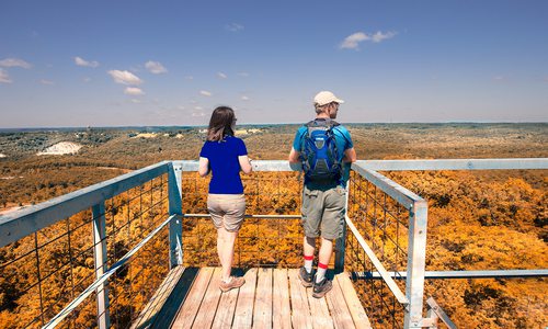 Couple at an overlook along the Glade Trail in the Ruth and Paul Henning Conservation Area