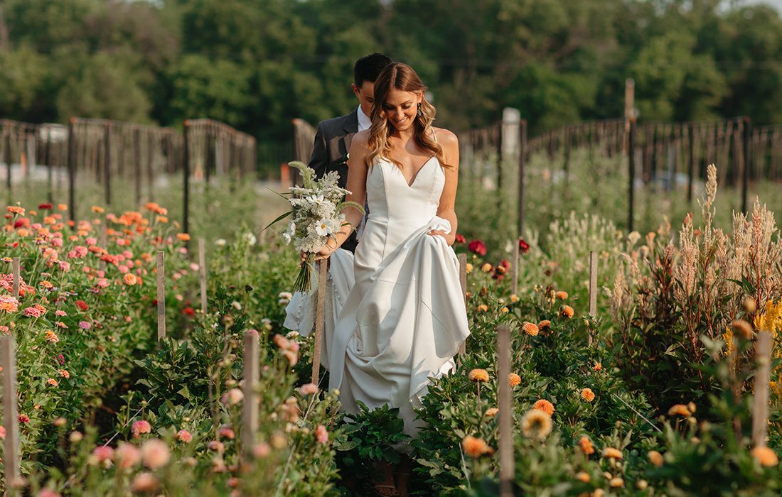 Bride walking among the flowers at Finley Farms.