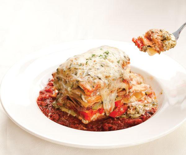 Cheesy lasagna with peppers, zucchini, red onions, mushrooms, sweet potatoes and spinach.