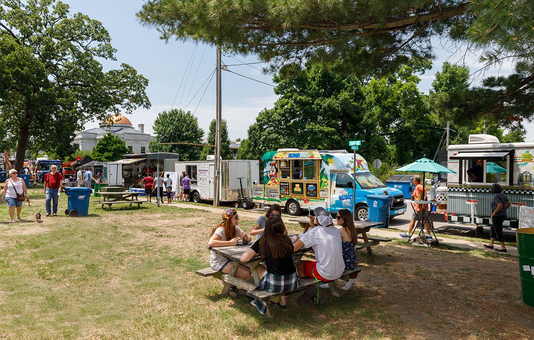 Group of people eating at Food Truck Fridays in Central Park