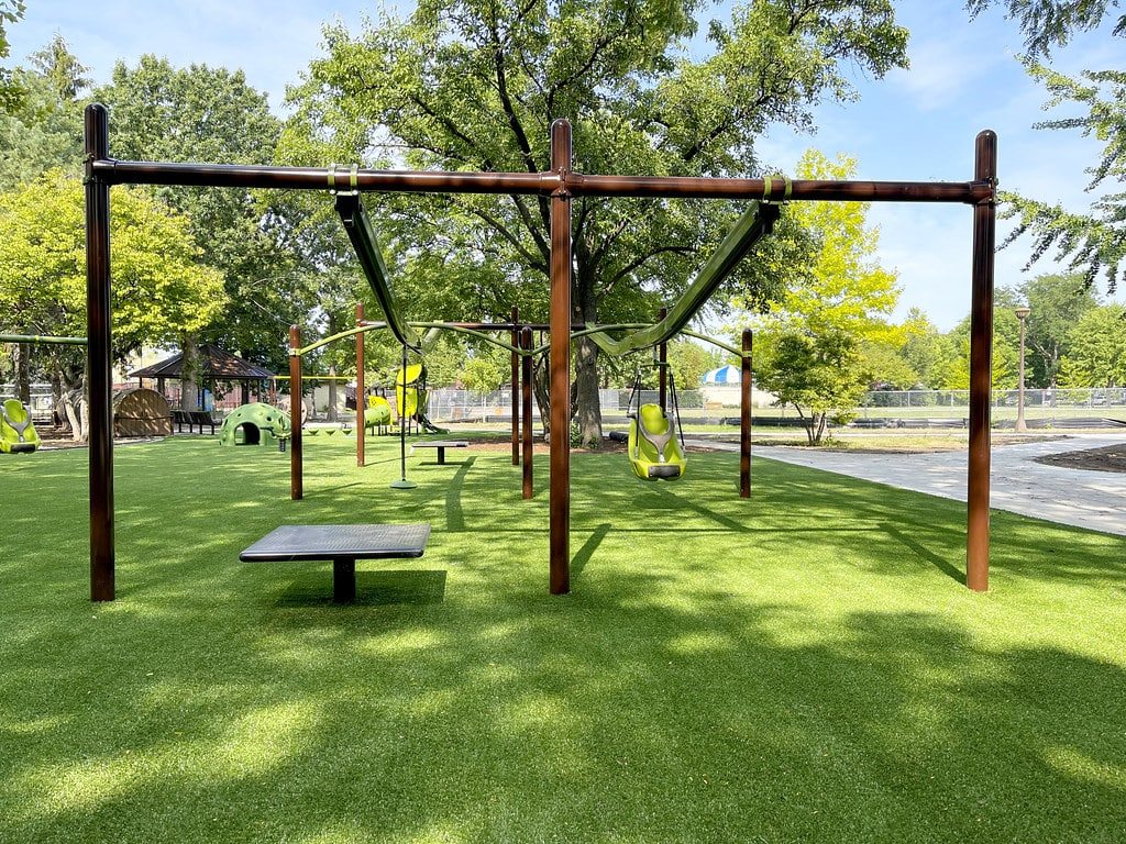 Landscaping done at a playground by ForeverLawn of the Ozarks.