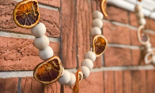 Beaded orange garland made by Heather Kane