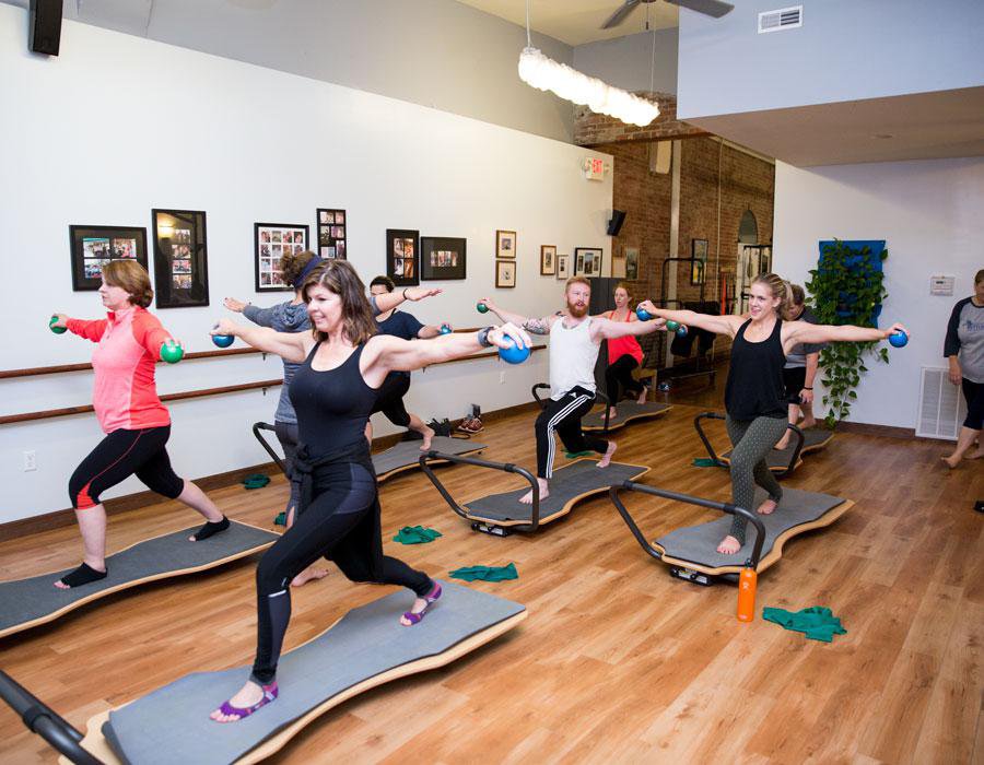 Participants move their Juvo Boards from the balance position to the elevate position for different exercises.