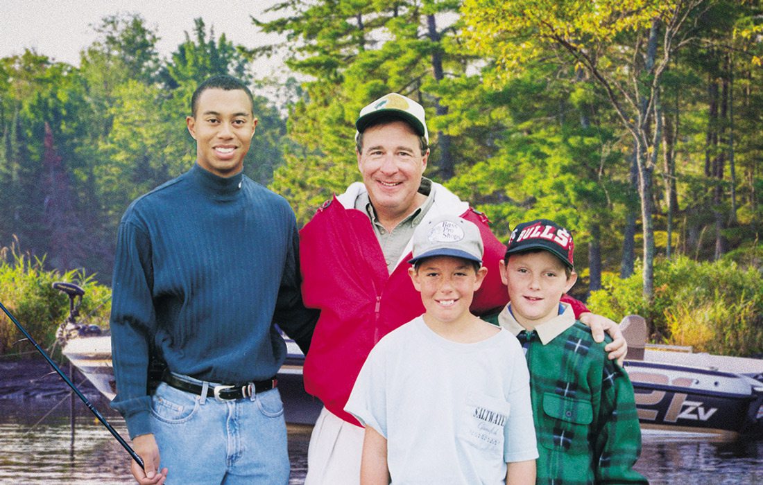 Tiger Woods and Johnny Morris on a fishing trip some 20 years ago with Morris’ son, John Paul (left), and a friend