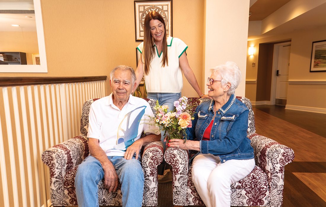 Residents with owner of Grateful Vase