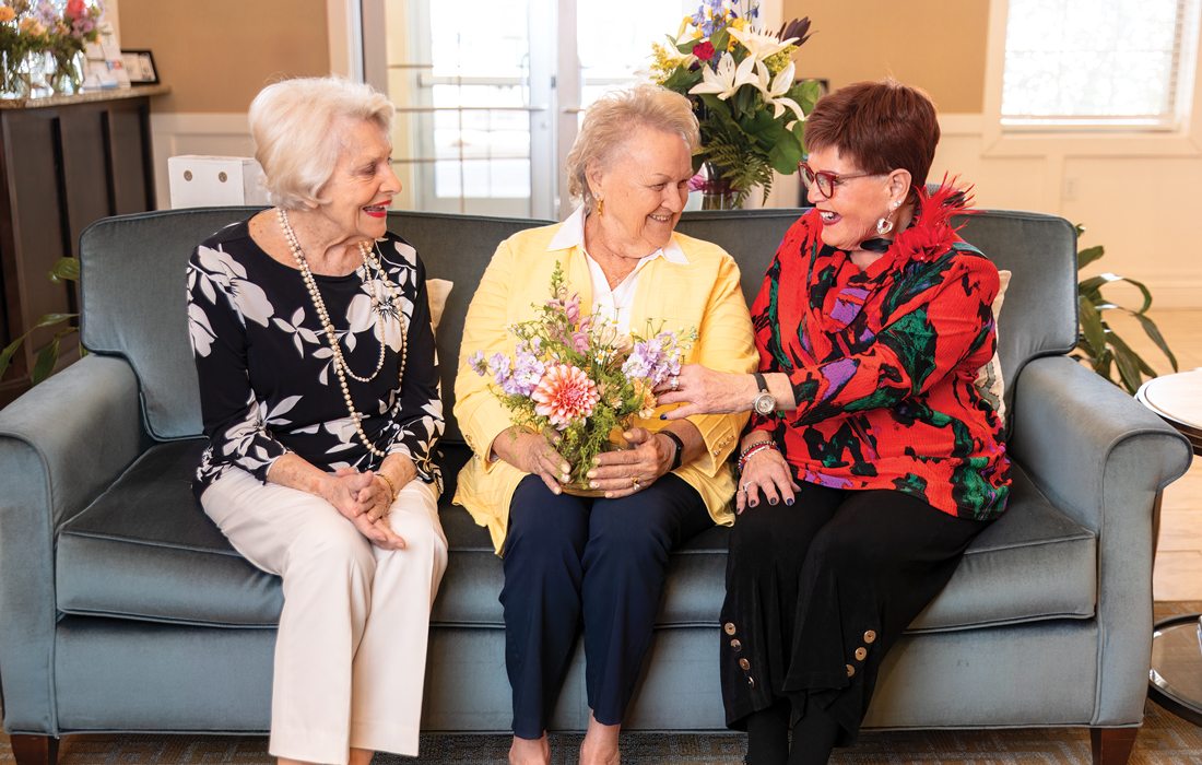 Eldery woman sitting otgether on a couch