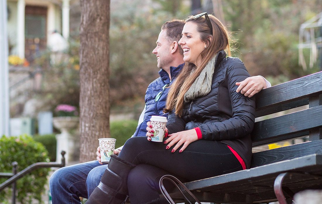 Couple on a park bench in Eureka Springs AR