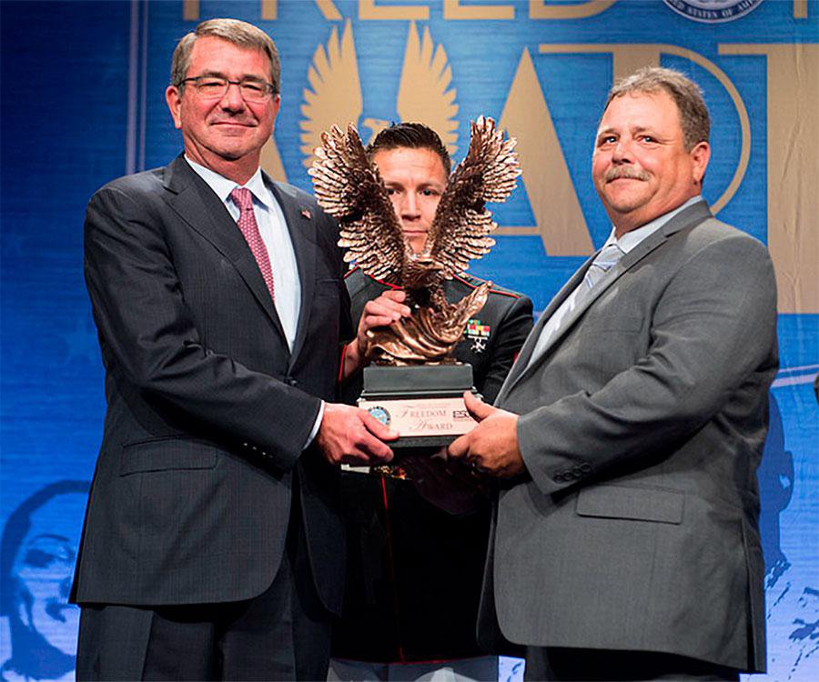 Frank Elston (right) received the Secretary of Defense Employer Support Freedom Award for employing veterans.