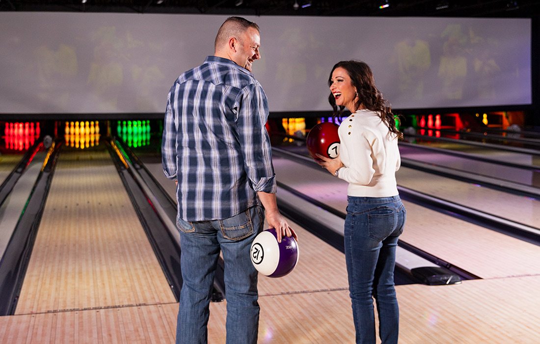 Two people at a bowling alley