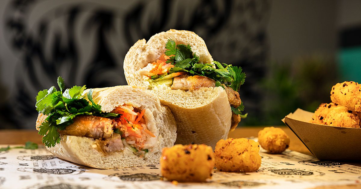 Pork Belly Banh Mi and tater tots at Lucky Tiger Sandwich Co.