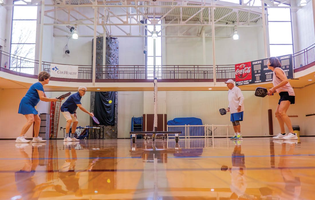 Indoor pickleball court with people playing pickleball in Springfield MO