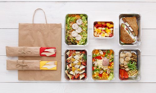 An assortment of meals and food sit in their kits, ready to eat.