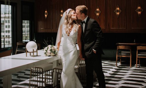 Merry Tucker and her husband on their wedding day at Vantage Rooftop Lounge in Springfield, MO