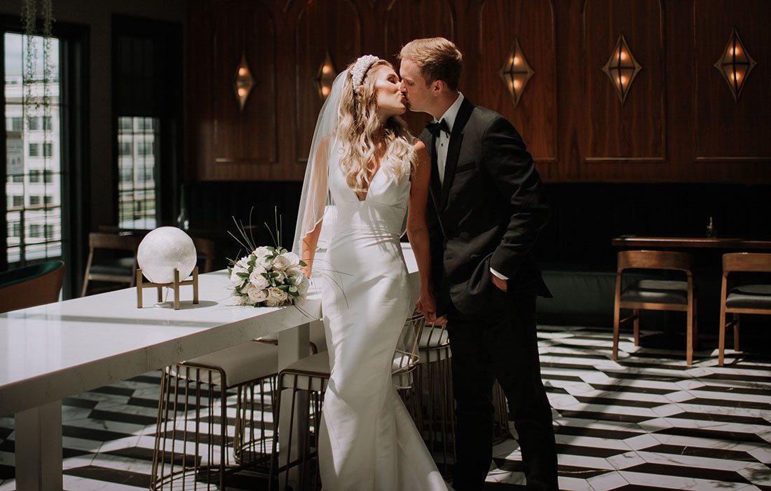 Merry Tucker and her husband on their wedding day at Vantage Rooftop Lounge in Springfield, MO