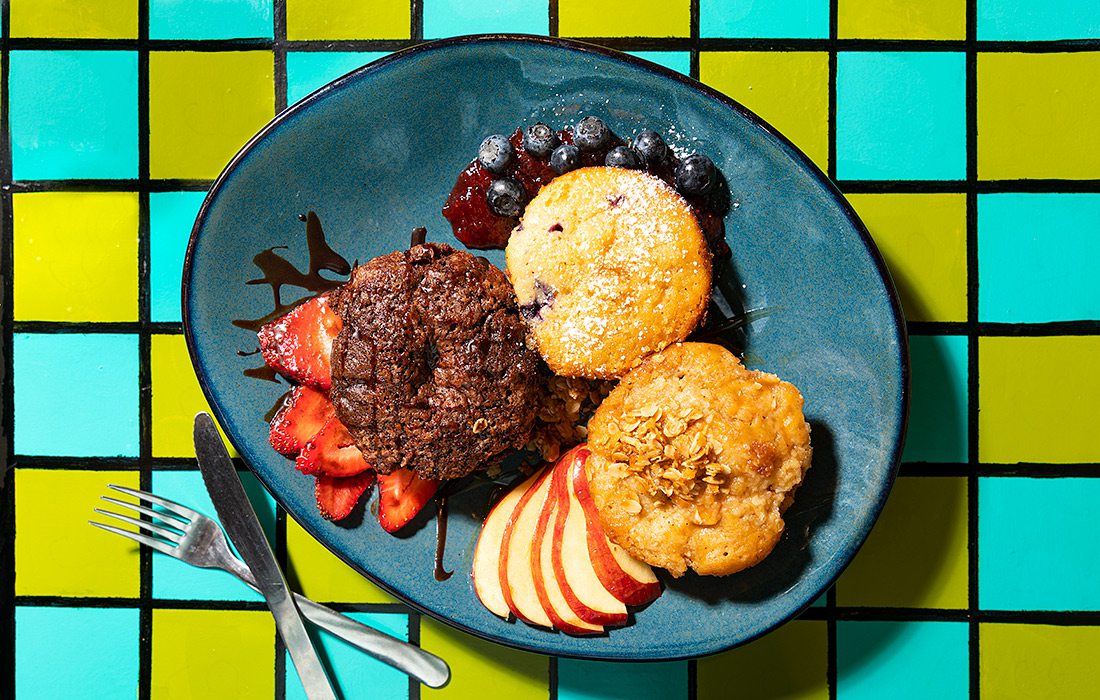 three muffins sliced fruit and jam at Morning Day Cafe in Nixa, MO