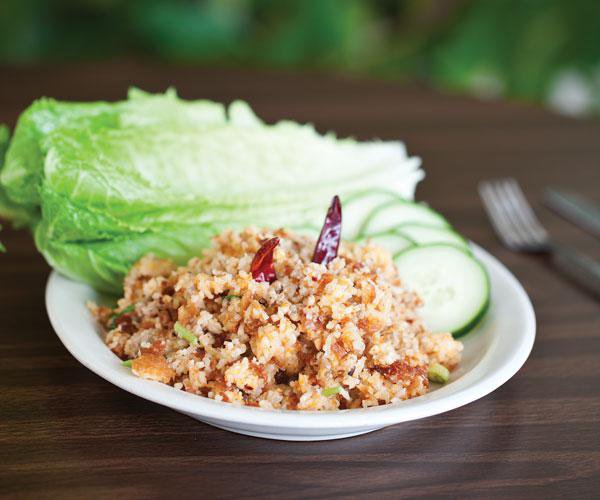 Nam with fried rice, pork, coconut, Thai herbs and lemon grass.