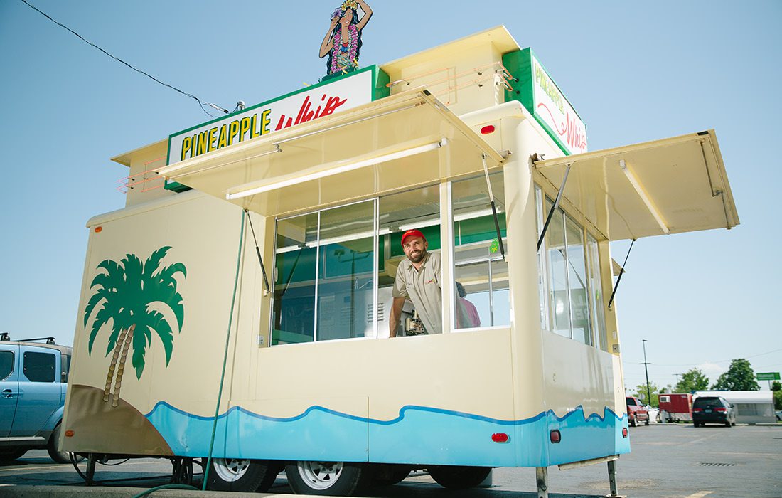 Zach Fortner, Owner of Pineapple Whip in Springfield MO, inside a Pineapple Whip cart