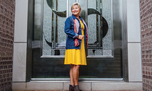 Bright yellow dress and jean jacket from Nixa Clothing Company