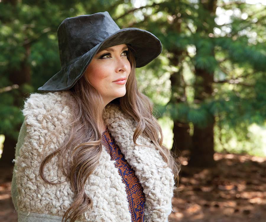 Young woman wearing a chic wide brimmed hat